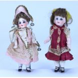 A miniature all original all-bisque doll in ‘ Polichinelle’ costume, German circa 1910,