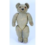 An early Chad Valley Teddy bear with button to ear, 1920s,