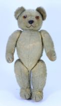 An early Chad Valley Teddy bear with button to ear, 1920s,