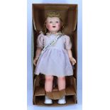 A large hard plastic ‘Winnie She walks! She talks!‘ doll in original box, 1950s,