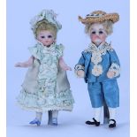 A miniature mignonette all-bisque doll in original blue silk dress, French circa 1890,