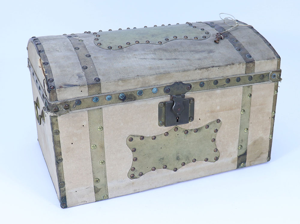 A late 19th century wooden linen and leather cover Dolls trunk,