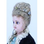 A ‘Queen Alexandra’ portrait wax over composition shoulder head doll, German circa 1905,