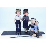 A painted wooden Sailor Dancing Jigger doll and four Sailor dolls, 1930s,
