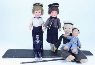 A painted wooden Sailor Dancing Jigger doll and four Sailor dolls, 1930s,