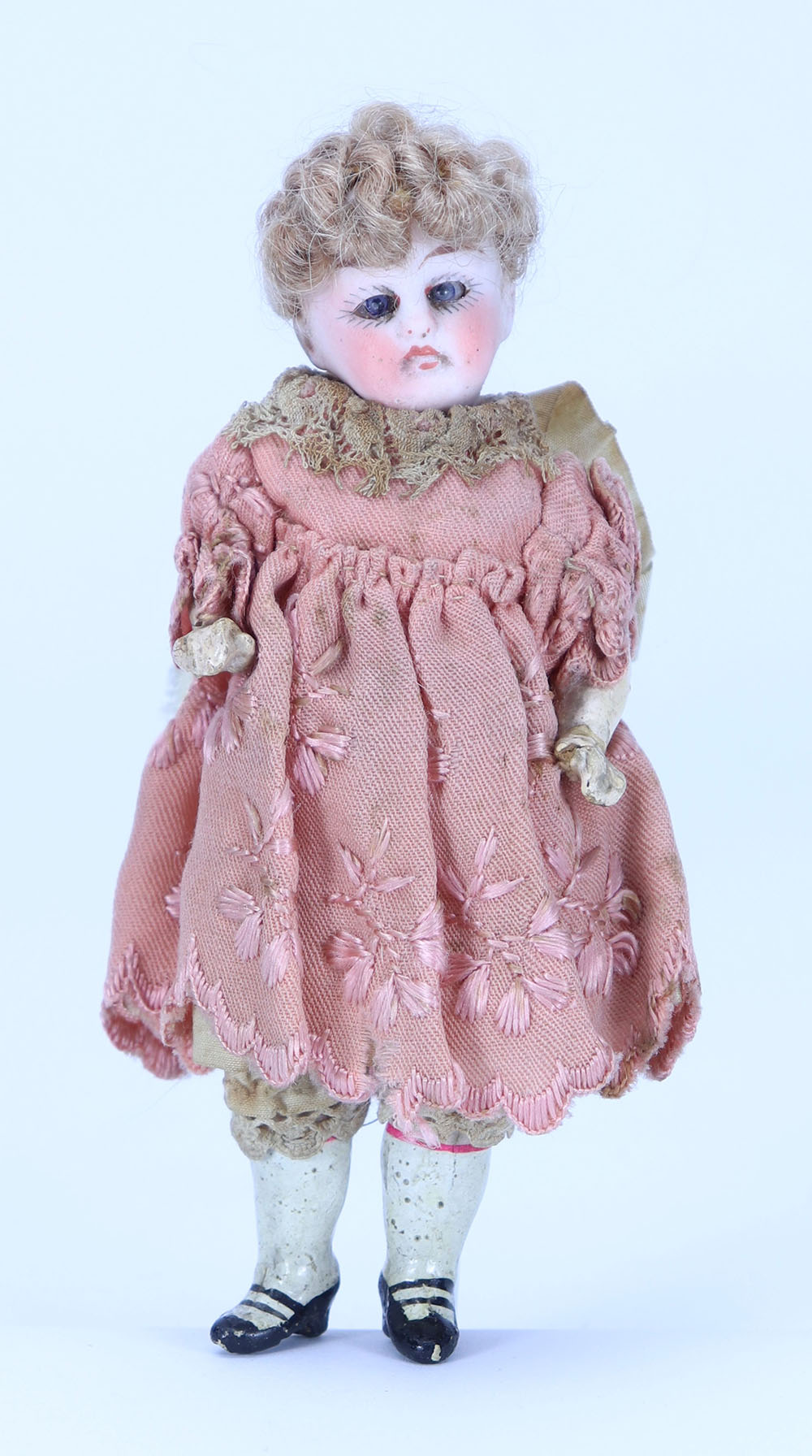 A miniature bisque head doll in original clothes, German circa 1910,