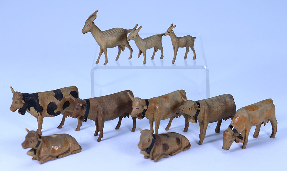 Finely carved wooden Erzgebirge cows and goats, 19th century,