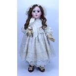 A beautiful and rare Jumeau Triste bisque head Bebe doll, size 13, French circa 1882,