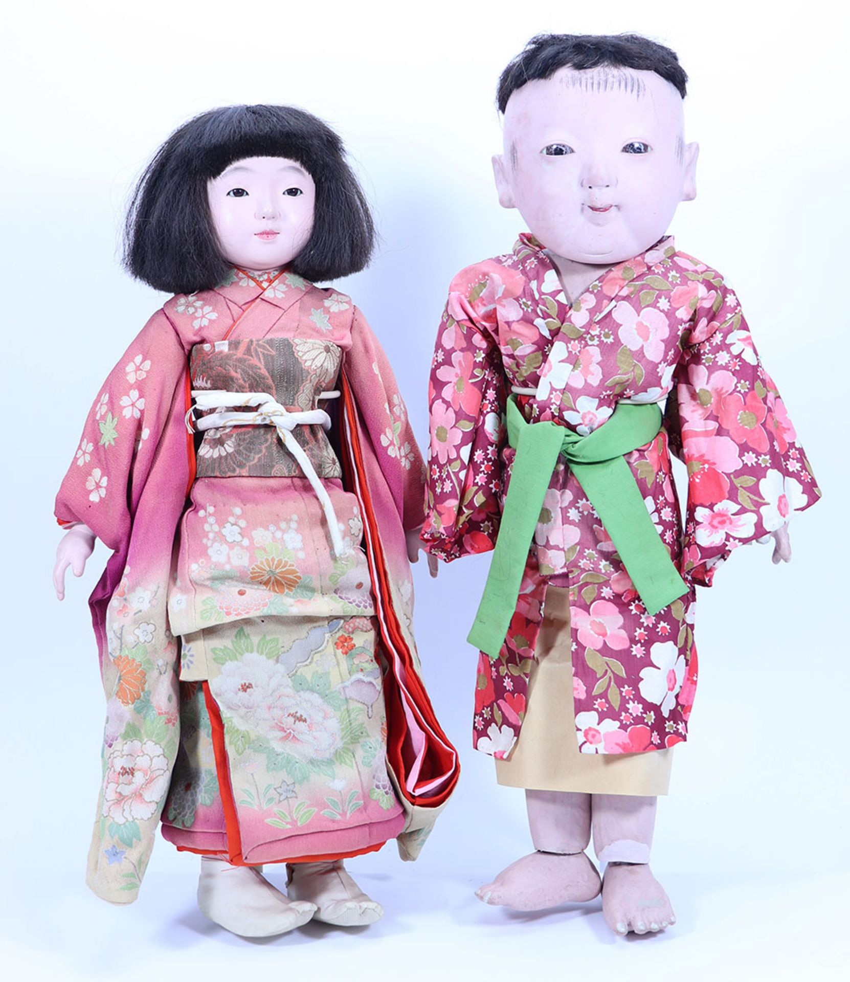 Eleven traditional Japanese papier-mache festival dolls,