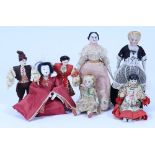 A group of seven various miniature dolls,