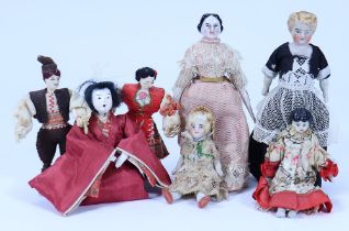 A group of seven various miniature dolls,