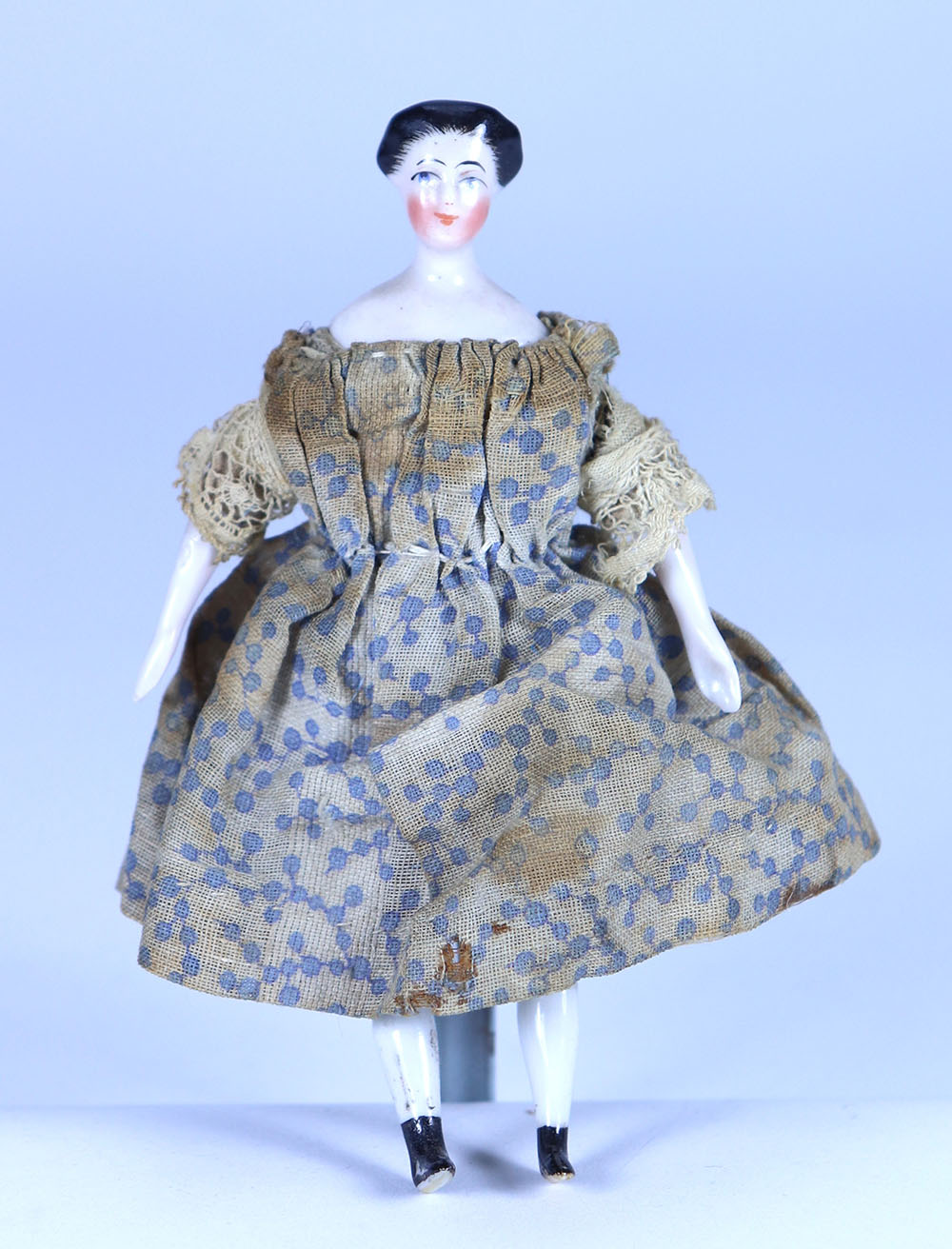 Early glazed china shoulder head doll in original clothes, German circa 1850,