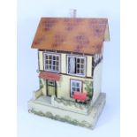 A D.H Wagner & Son painted wooden dolls house with contents, German 1920s-30s,