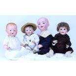 Four various bisque head baby dolls,