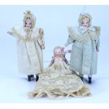 A pair of all original miniature painted bisque shoulder head twin dolls, circa 1910,