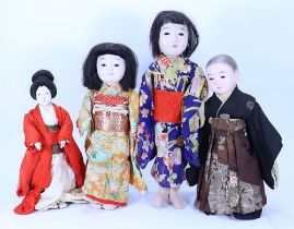 Four traditional Japanese papier-mache festival dolls,