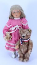 Steiff doll Lore with her miniature bear, circa 1990,