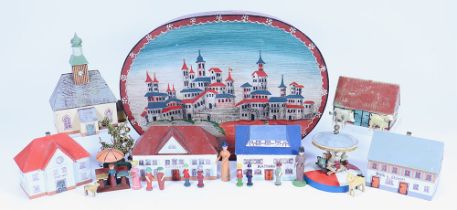 Wooden painted Erzgebirge buildings, carousel and figures, early 20th century,