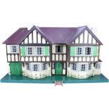 A good example of a Tri-ang No.93 large Dolls House in Tudor style, English 1930s,