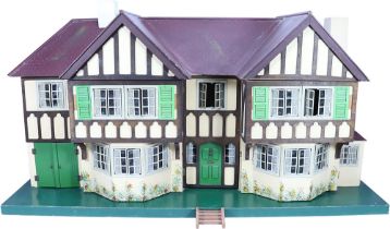 A good example of a Tri-ang No.93 large Dolls House in Tudor style, English 1930s,