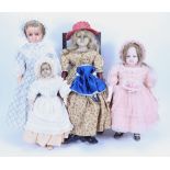 Four various wax dolls,