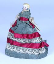A miniature Parian-type bisque shoulder head doll in original clothes, German circa 1850,
