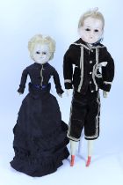 ‘Dick & Hanah’ a pair of Early wax over composition shoulder head dolls, German circa 1860,