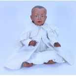 A Kammer & Reinhardt 100 brown bisque head character baby doll, German circa 1910,