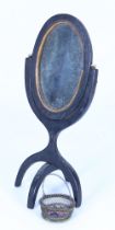 An early 19th century miniature floor standing swing mirror,