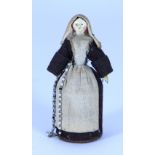 A sweet miniature painted wooden Grodnertal doll dressed as a Nun with pill box to skirt, German 182
