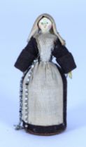 A sweet miniature painted wooden Grodnertal doll dressed as a Nun with pill box to skirt, German 182