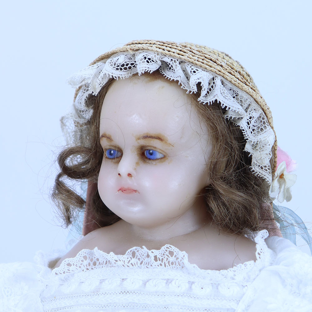 A Montanari poured wax shoulder head English doll, 1860s,