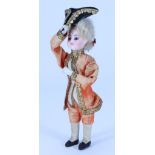 A miniature bisque head squeeze-toy gentleman doll with tricorn hat, probably French circa 1890,