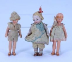A miniature all-bisque doll in original clothes, German circa 1920,