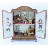 A charming wooden miniature dolls house in French armoire style, circa 1890,