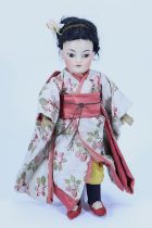 A Simon & Halbig 1199 bisque head Asian doll, German circa 1910,