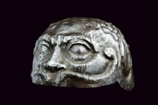 An embossed helmet in Negroli style