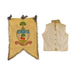 A banner and a waistcoat of a Scottish regiment