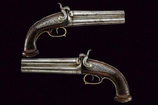 A rare pair of over-and-under barreled percussion pistols for the Oriental market