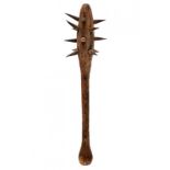 A rare wooden hafted club with spikes