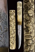 A fine knife with sculpted bone scabbard