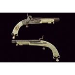 A rare pair of percussion pistols by Campbell