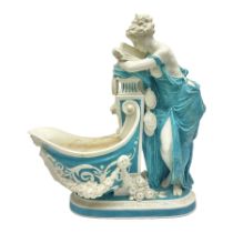 Rare 19th century Minton turquoise glaze majolica 'The Reader' flower holder