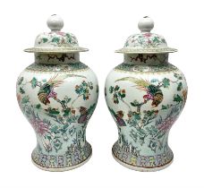 Pair of 19th century Chinese Famille Rose vases and covers