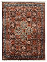 Persian indigo and rust ground carpet