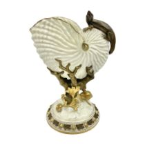 A late 19th Century Royal Worcester vase modelled as a nautilus shell surmounted by a gilt lizard