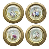 Set of four early 20th century Continental bisque plaques