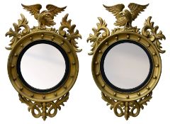 Pair of Regency period giltwood convex wall mirrors