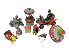 Nine tinplate and clockwork models to include battery operated ‘Antique Car’ by Toys Namura of Japan