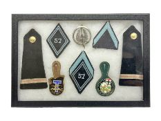 Eight French 57th Regiment Corps Transmissions (signals) metal and cloth badges/insignia; in small d